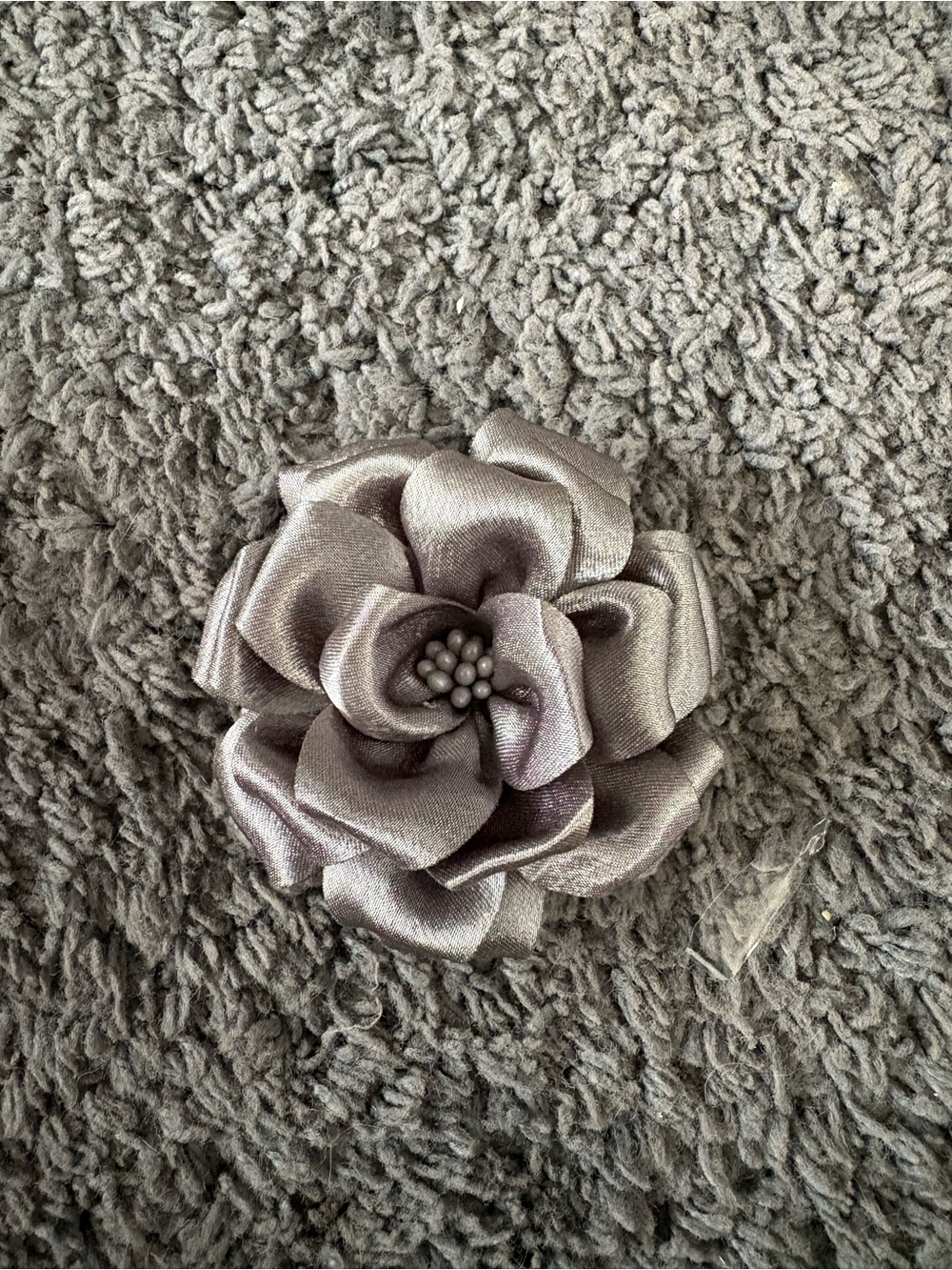 NWOT grey ribbon flower with dots in the center hair clip